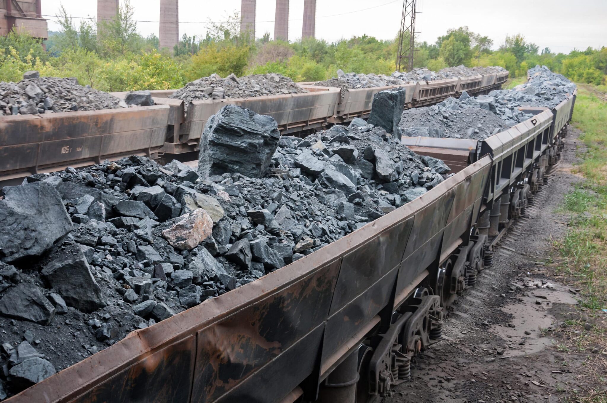 train of tipping cars loaded with raw iron ore at wagon unloadin