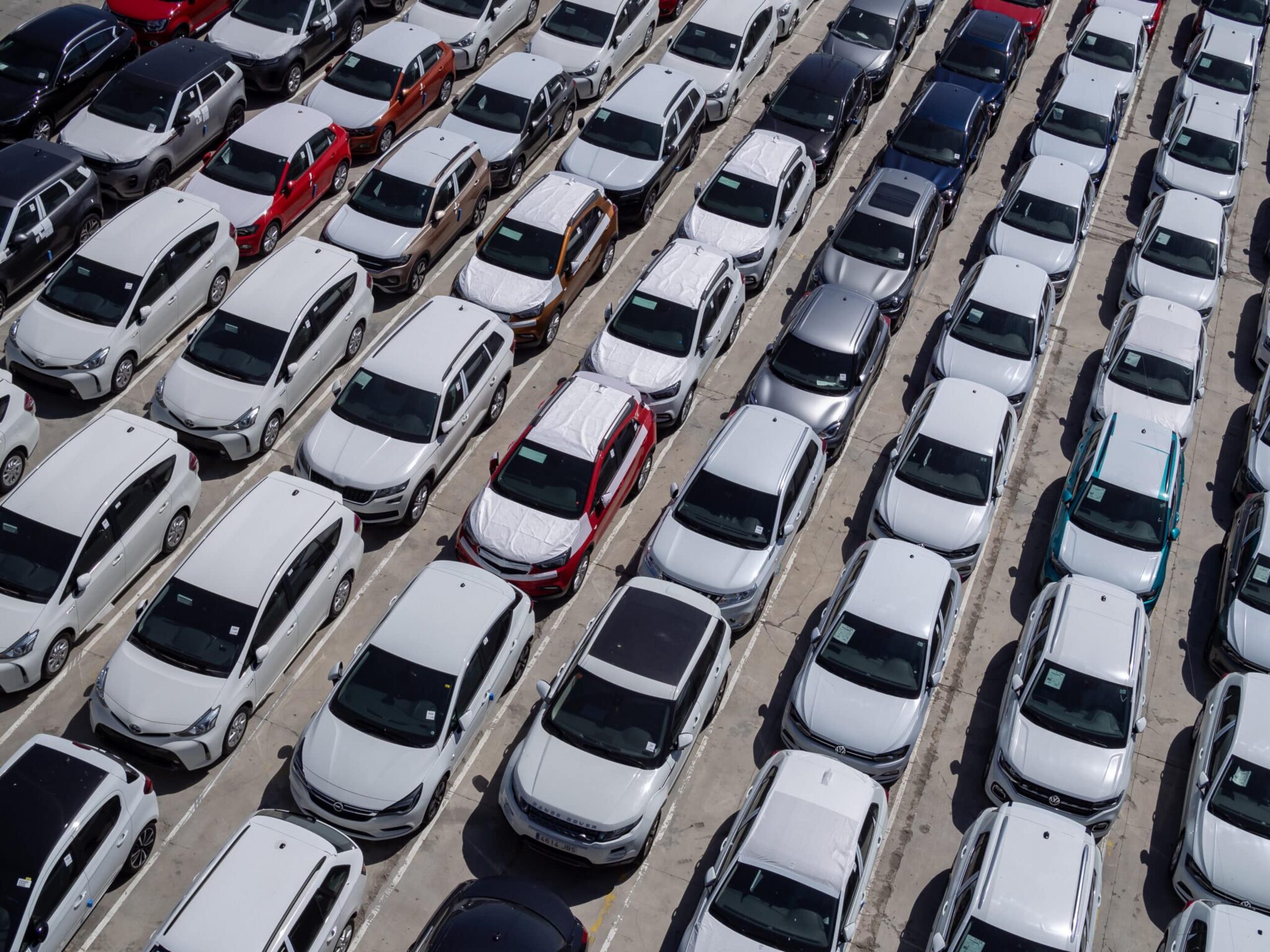 new-cars-parking-lot-aerial-view-sunny-day