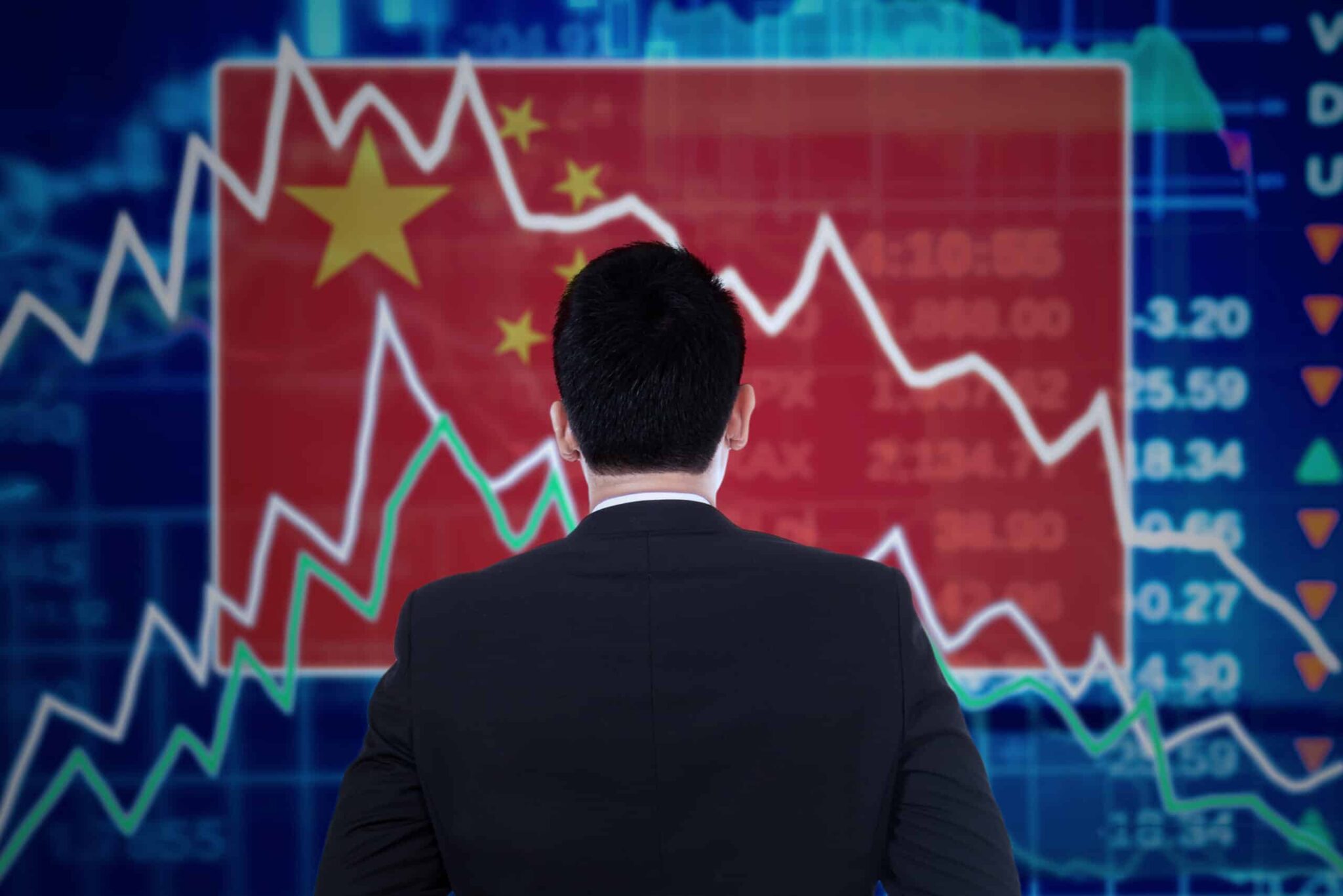 man-looking-at-a-declining-graph-with-chinese-flag